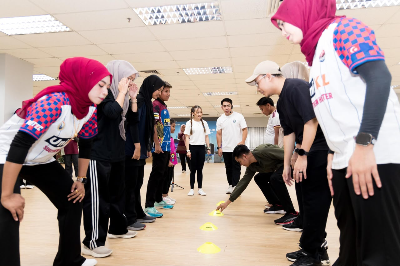 Participants facing one another during an interactive cone activity